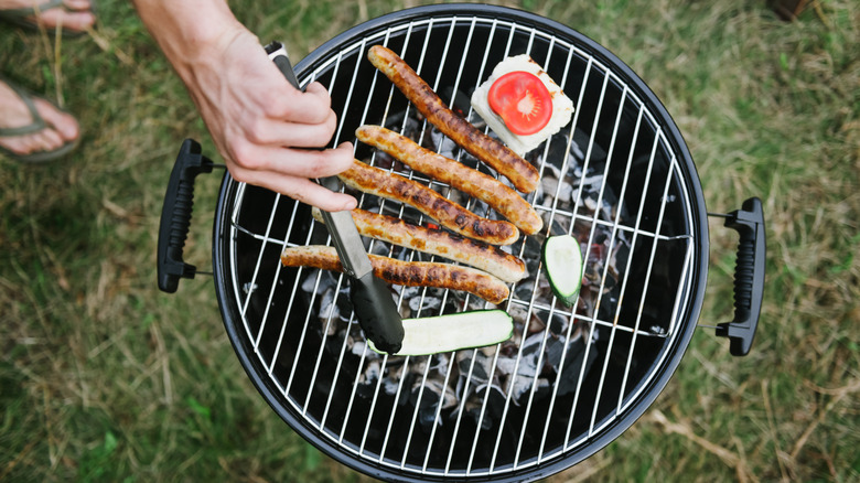 sausages on charcoal grill