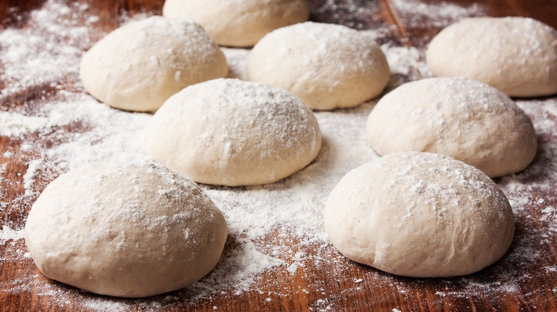 Pizza dough balls on table