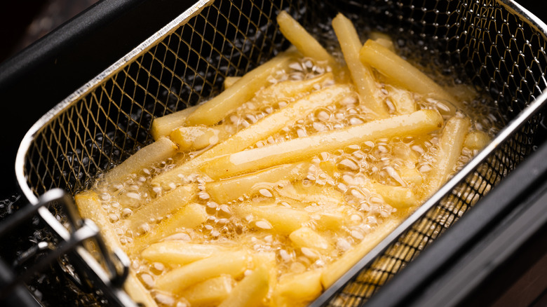 Fries cooking in deep fryer