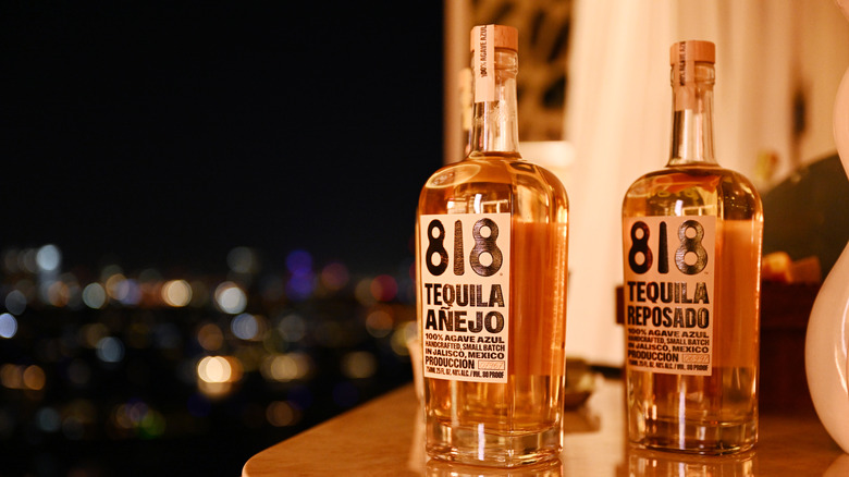 bottles of 818 tequila on bar