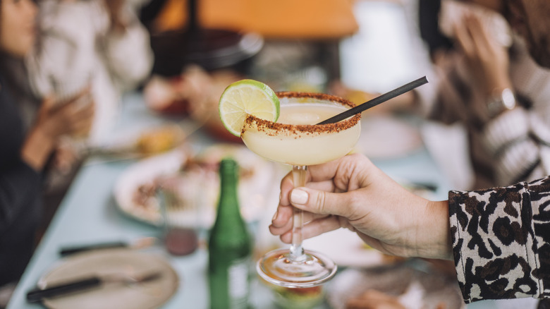 Hand holding up a margarita