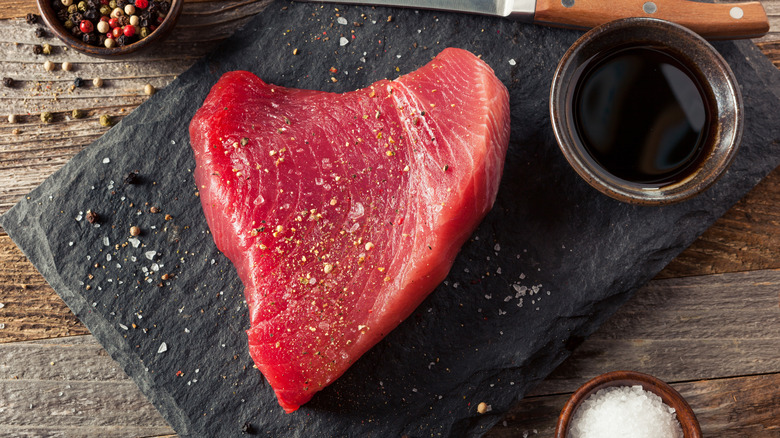 Raw tuna steak with salt and pepper