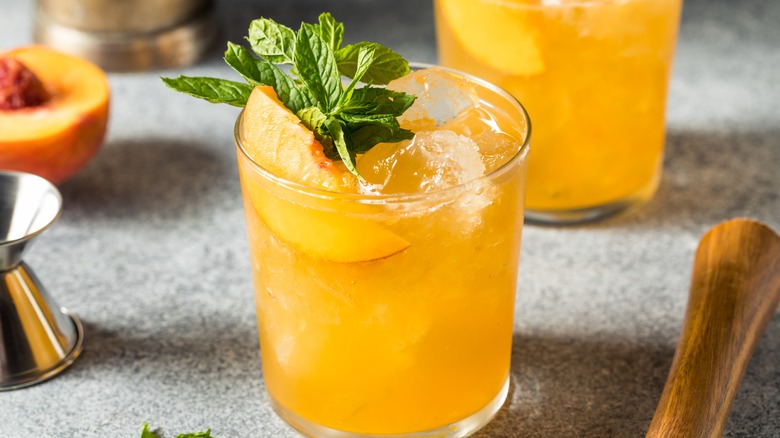 peach cocktail with mint garnish