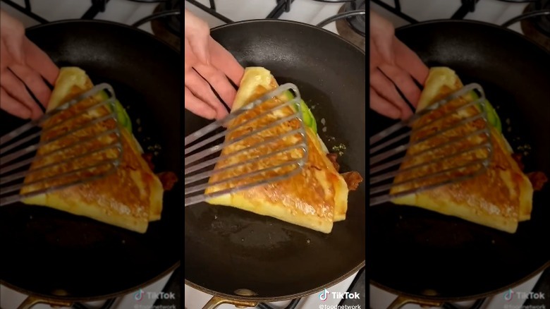 frying tortilla egg sandwich