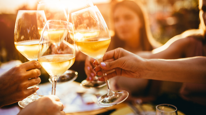 toasting with wine glasses