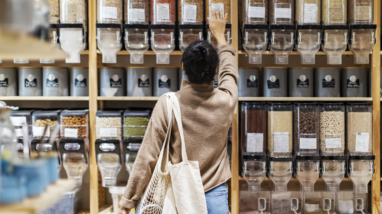 woman shopping in bulk aisle