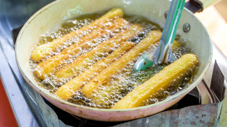 Churros cooking in oil 