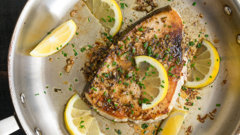 fish being fried in pan