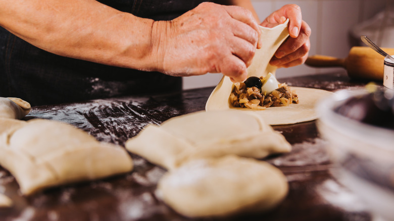 making empanadas with tortillas