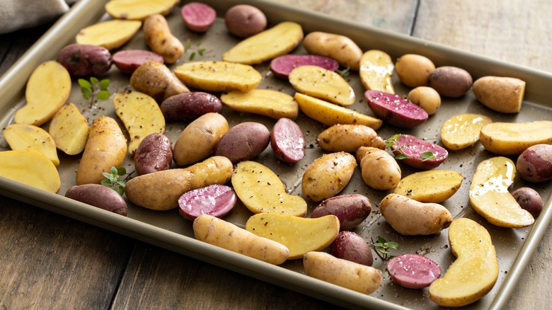 Raw fingerling potatoes on tray