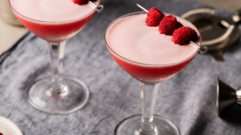 cocktail garnished with raspberries