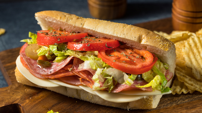 Italian sub sandwich on a wooden board