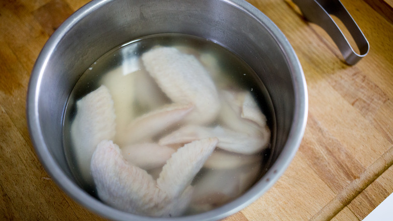 Chicken soaking in water 