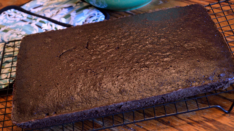 Chocolate sheet cake on cooling rack