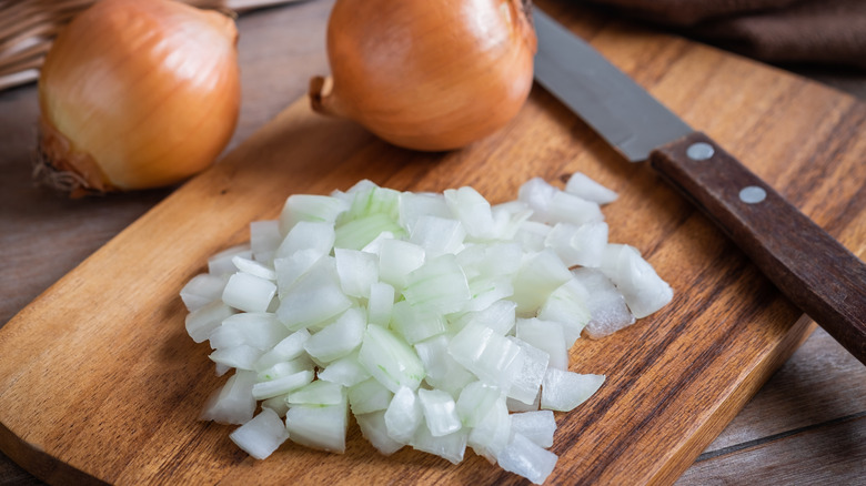 Diced onion on a chopping board