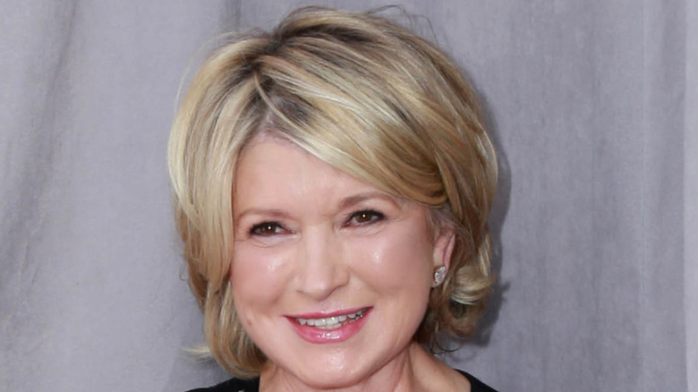 Martha Stewart in front of white curtain