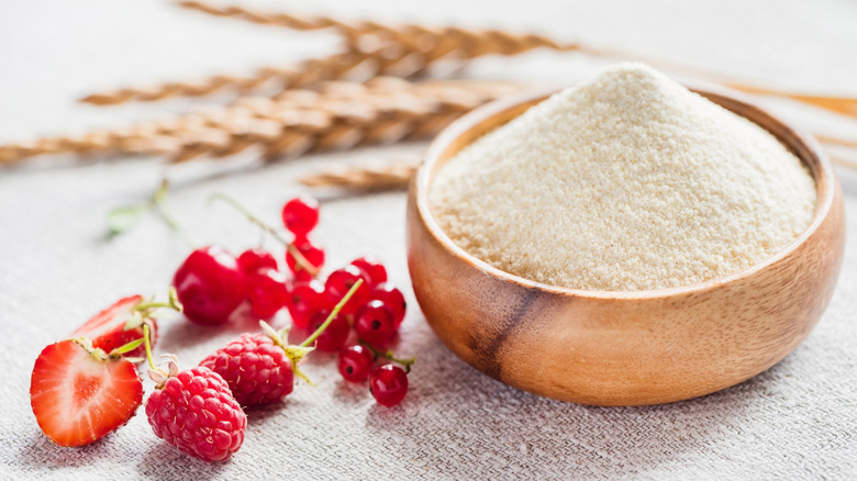 berries next to bowl of flour