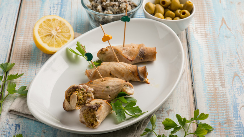 Rolled swordfish fillets on a plate