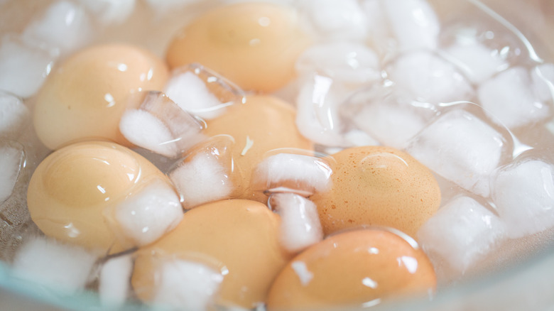 Boiled eggs in a bowl of ice waer