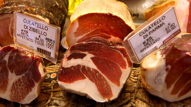 Proscuitto on display at a market