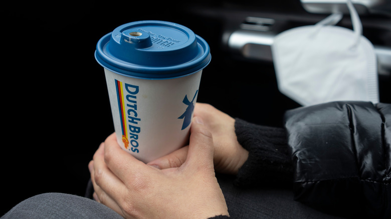 person holding a coffee drink from Dutch Bros