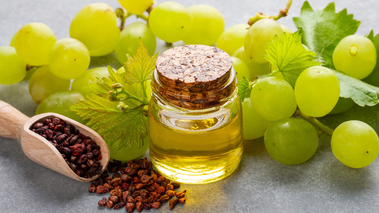 grapeseed oil surrounded by fresh grapes