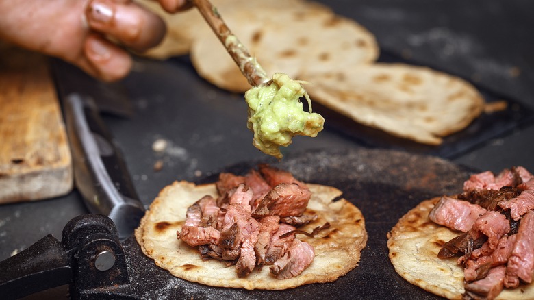 chef making tacos