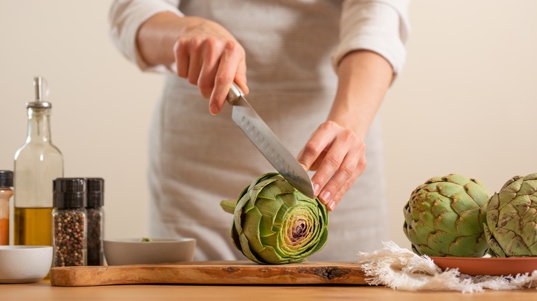 Chef cutting an artichoke