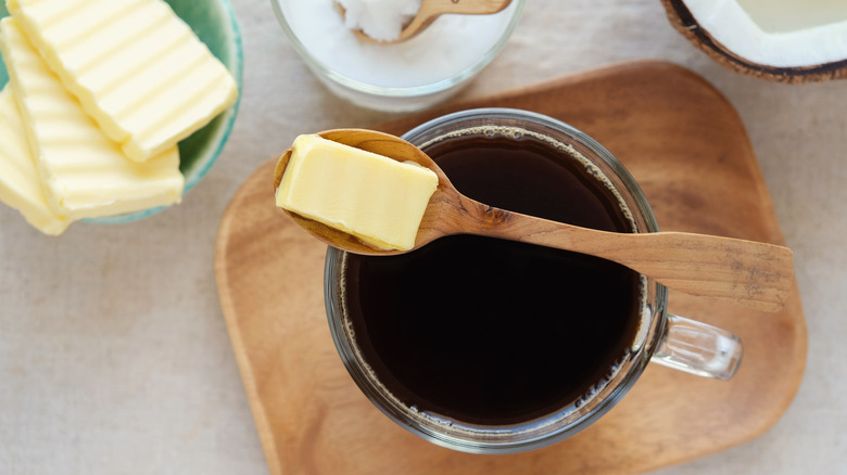 butter on spoon over coffee