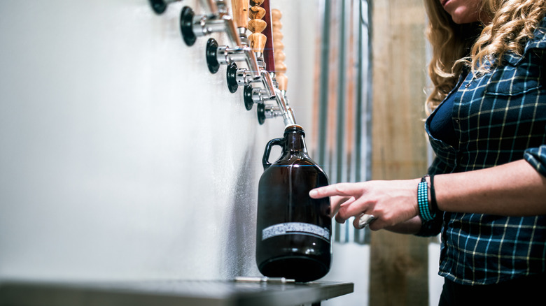 Growler getting filled with beer at a brewery