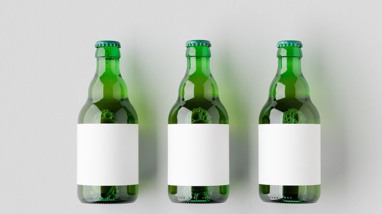 Three green steinie beer bottles