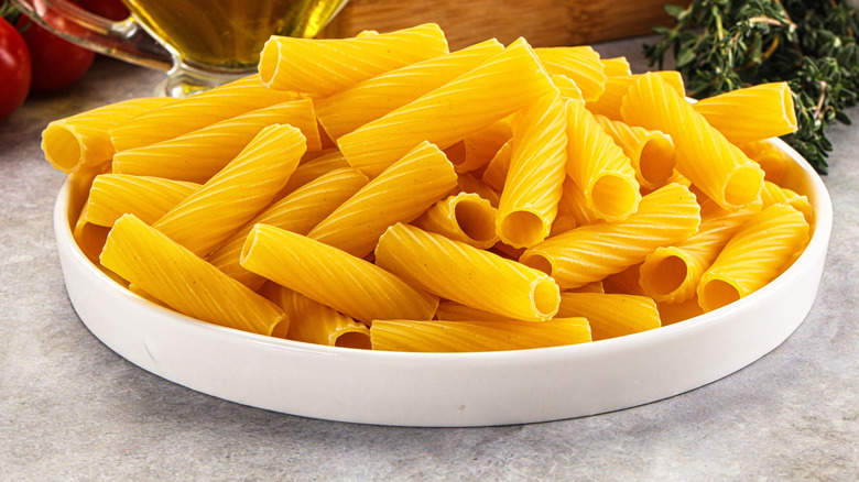 A bowl of bright yellow dried pasta