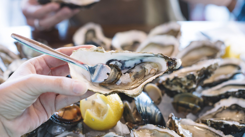 An oyster with an oyster fork