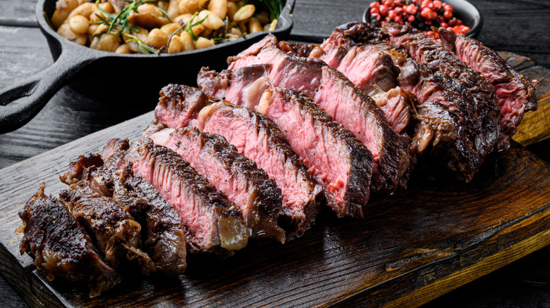 Medium rare sliced steak with garlic