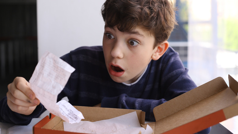 boy surprised by takeout bill