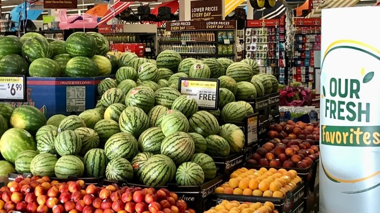 Produce section of Lucky California with lots of watermelons