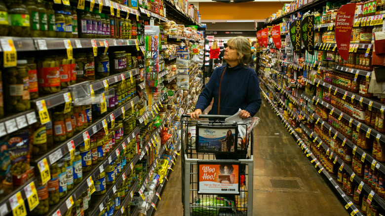 Woman shopping in the aisles of Ralphs