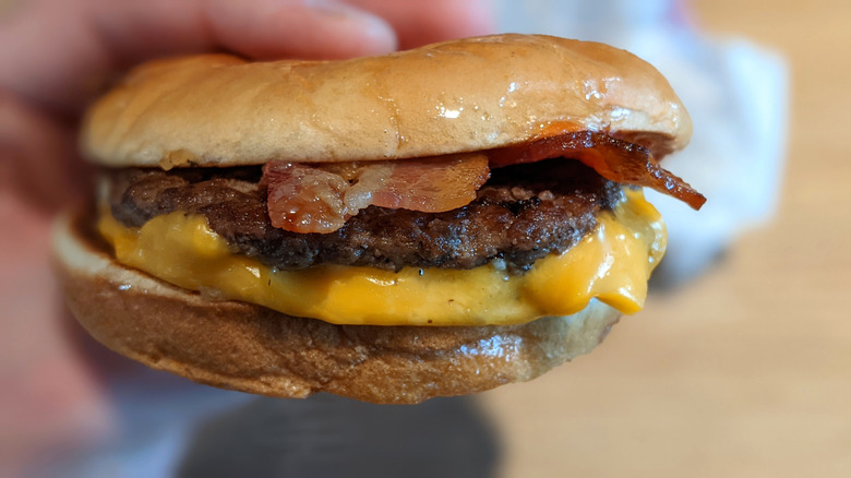 McDonald's Bacon McDouble closeup in hand