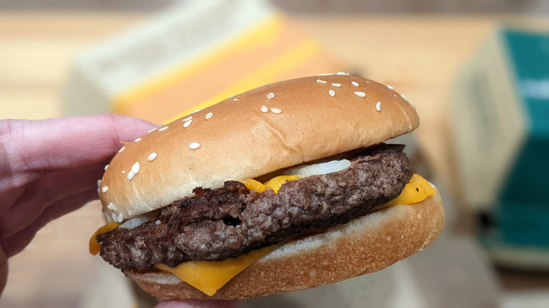 McDonald's Quarter Pounder With Cheese in hand