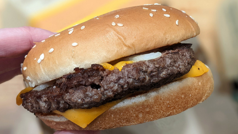 McDonald's Quarter Pounder With Cheese in hand