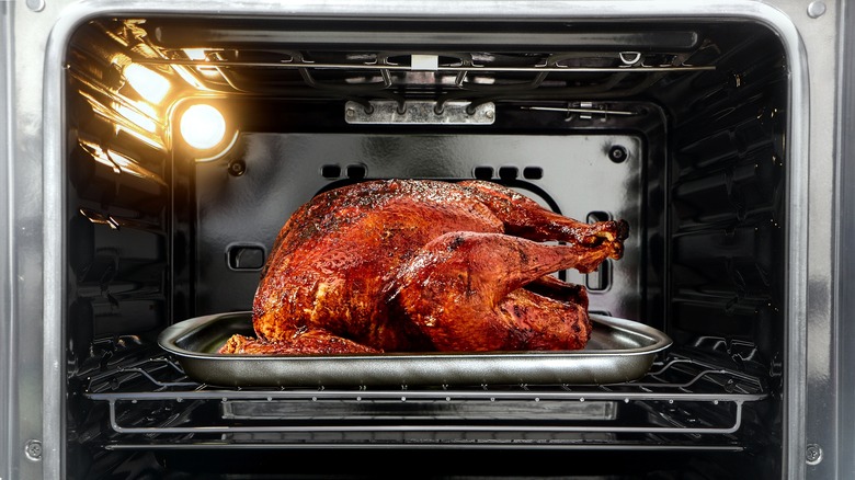 Turkey roasting in open oven