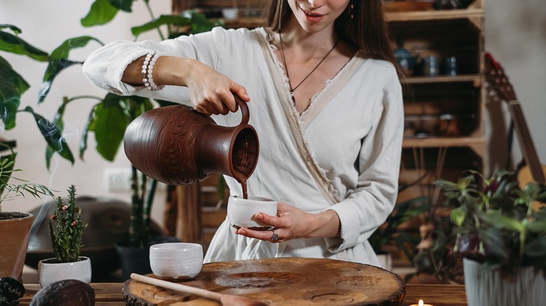 Woman pouring hot chocolate