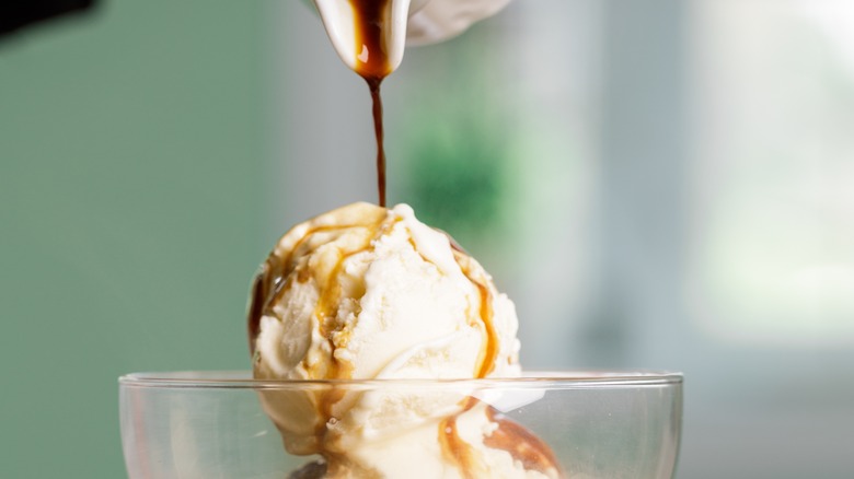 pouring sauce on ice cream