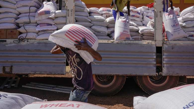 Unloading truck food aid, wheat