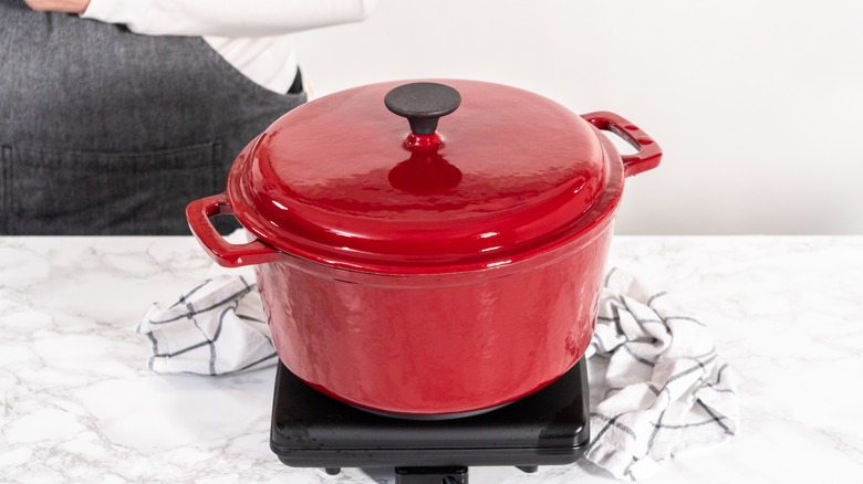 Red Dutch oven on counter