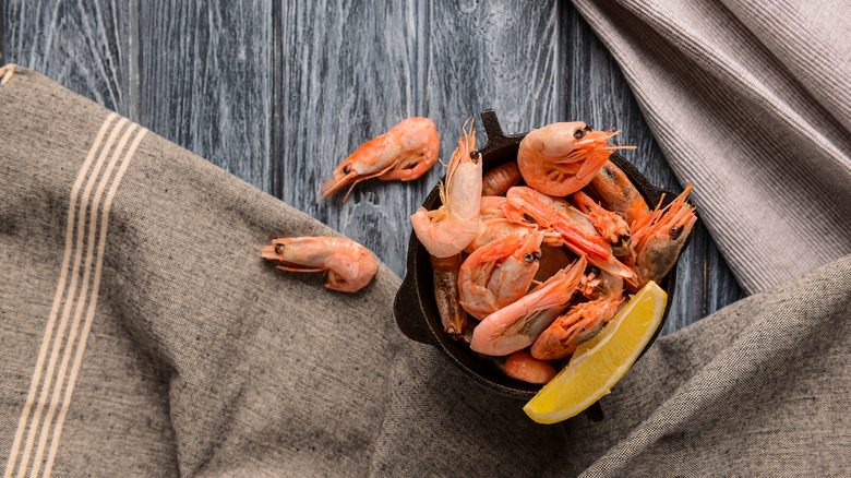 shrimp in bowl with lemon slice