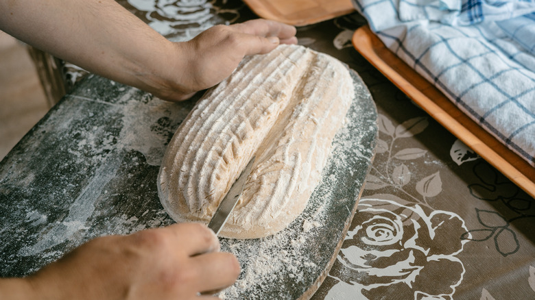 slashing raw bread dough