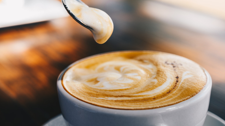 latte with spoonful of froth