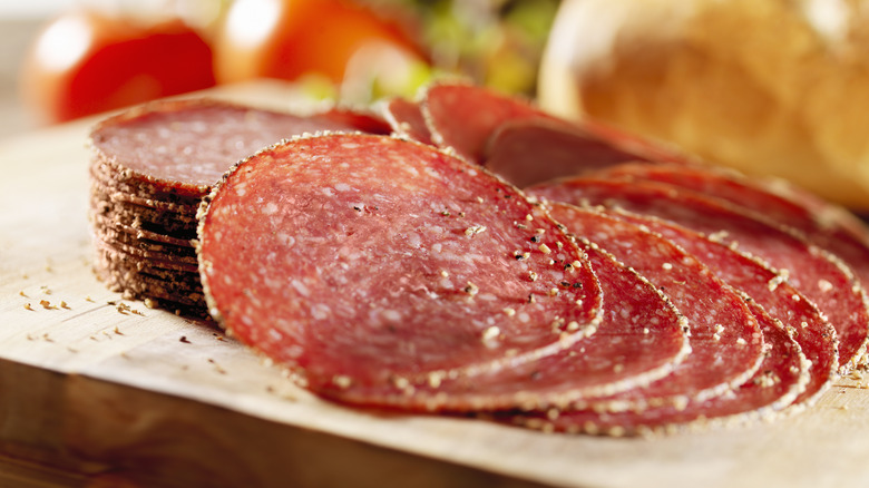 pepperoni slices on wood board