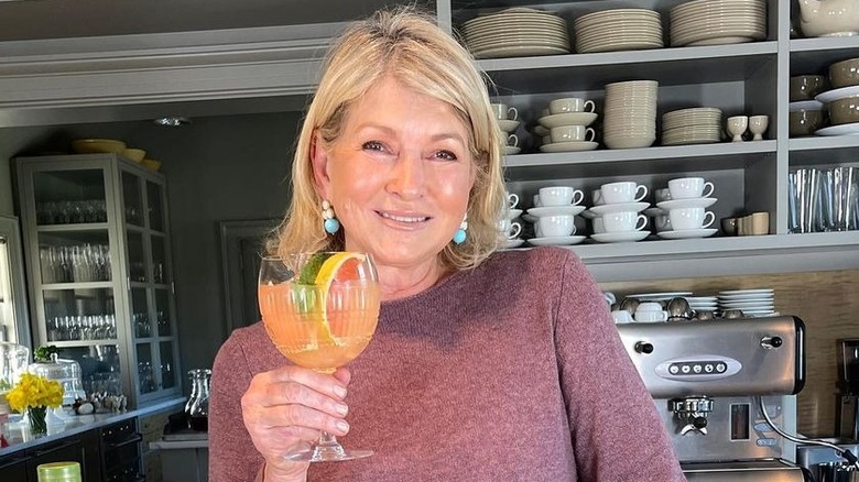 Martha Stewart in the kitchen with drink